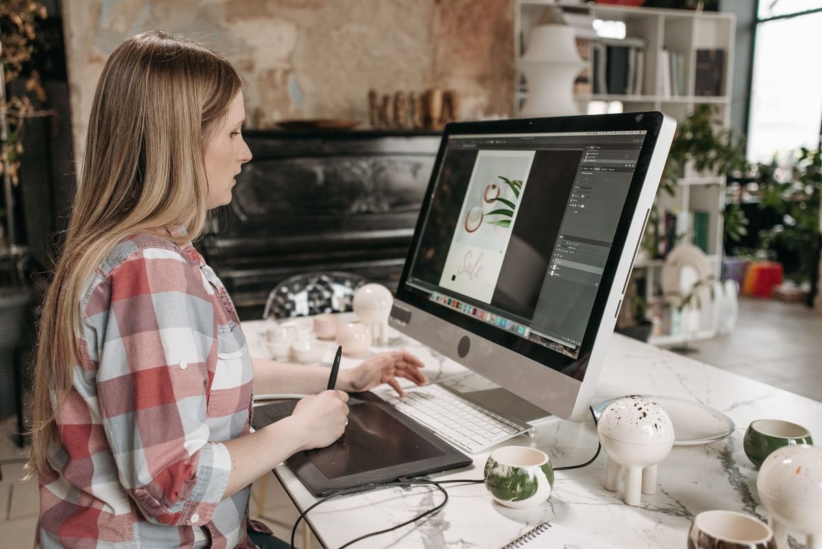 A designer editing vector graphics on a computer, relevant to free alternatives to Adobe Illustrator