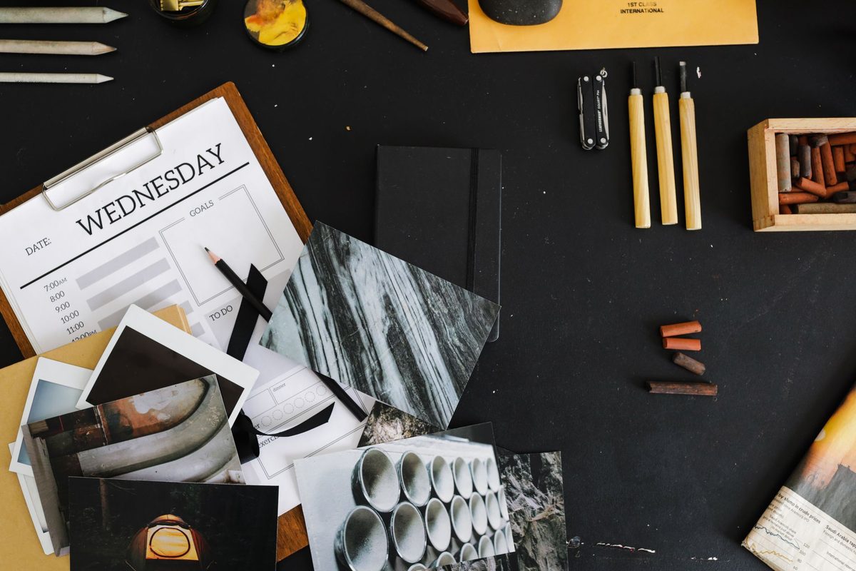 A designer arranging a page layout, relevant to free alternatives to Adobe InDesign