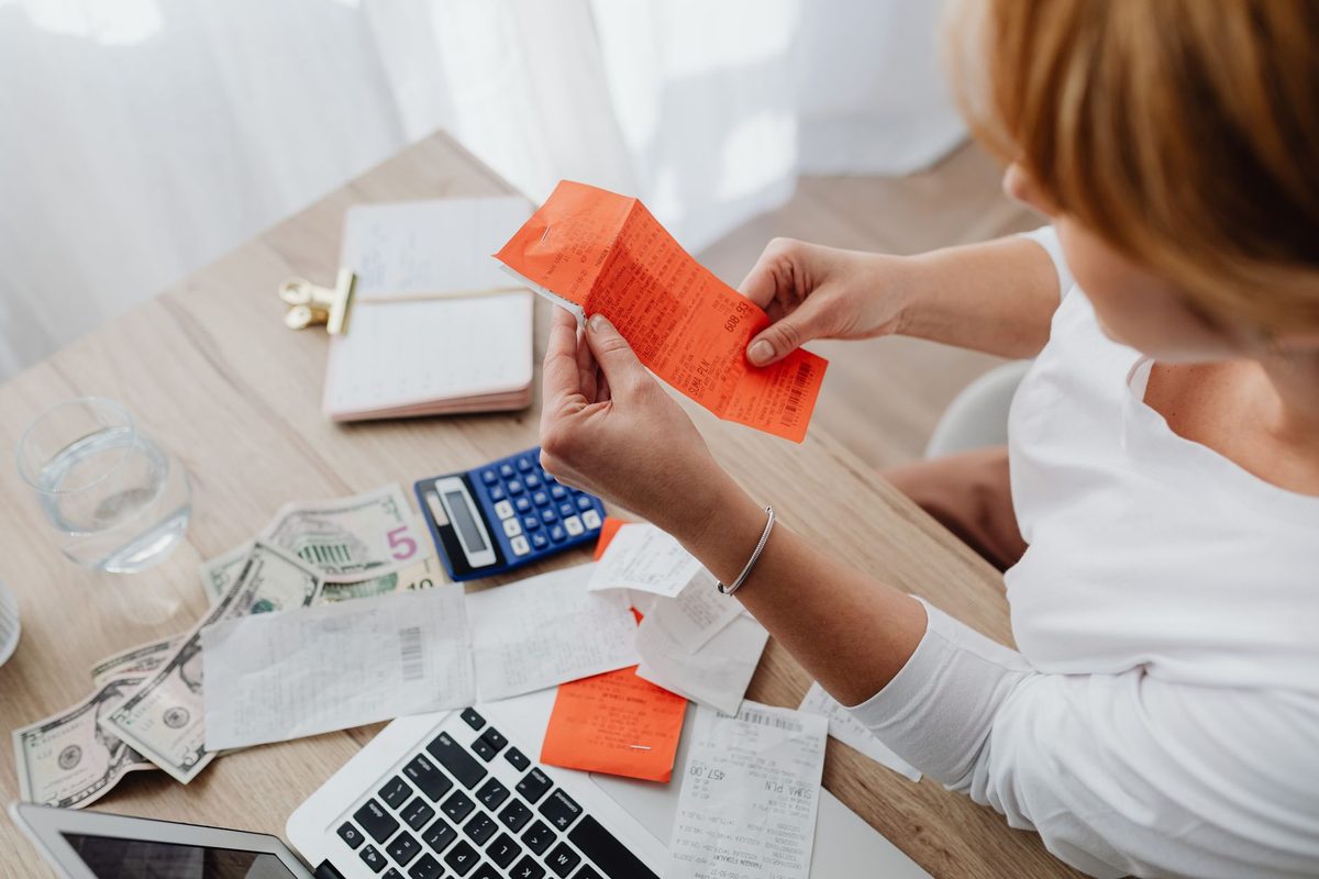 Reviewing invoices and figures at a desk, relevant to free alternatives to QuickBooks