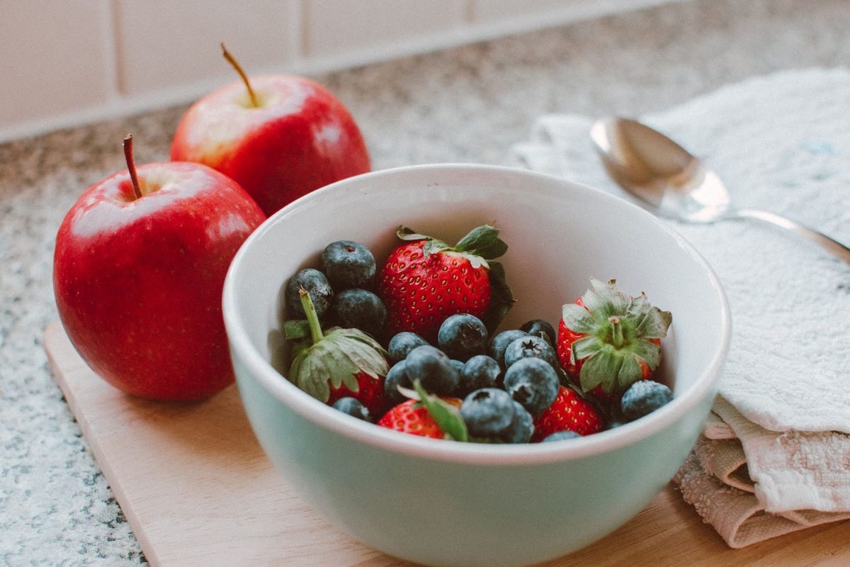 Fresh fruit on a kitchen counter, relevant to how to get rid of fruit flies